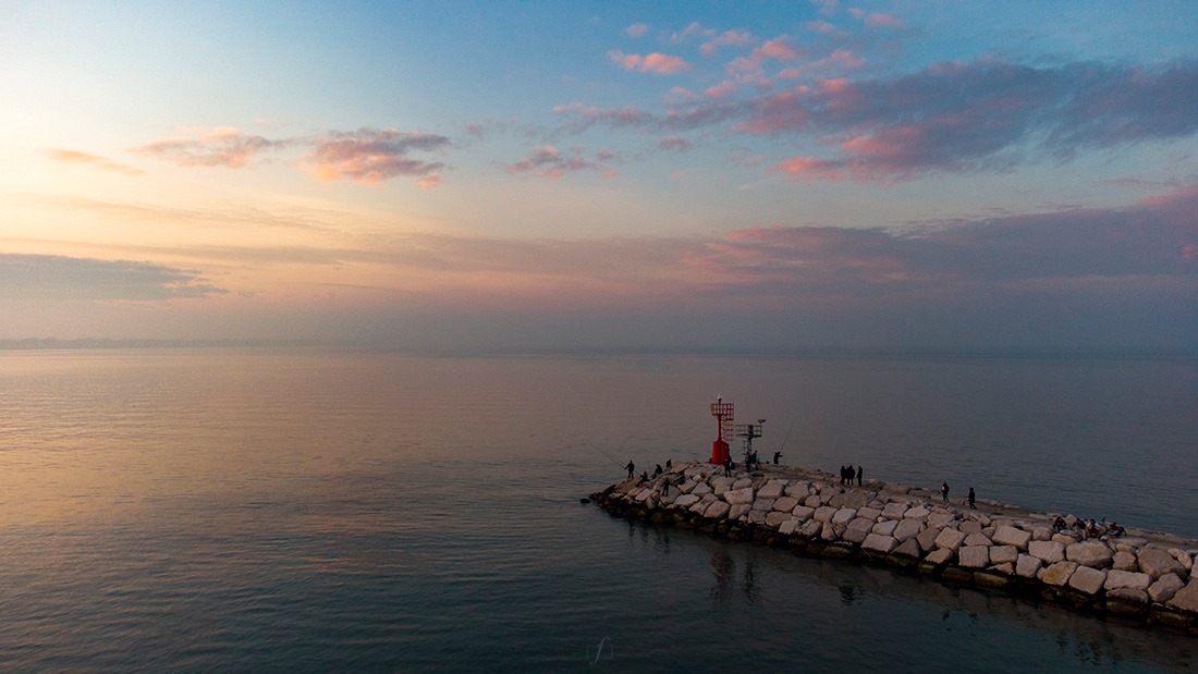 Sunset on Rimini pier near the beach